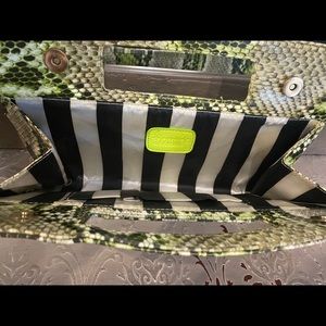 Green animal print clutch with stripes inside